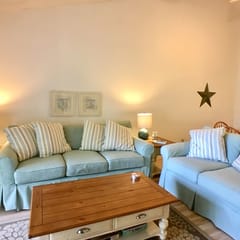 Nicely decorated and well maintained, upper-level apartment in Eaton Village offers golf course view