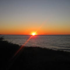 On the North Side of 6A in Brewster, just a stone's throw away from the picturesque Cape Cod Bay.